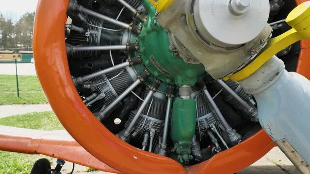 Engine and propeller of a small aircraft. 9-cylinder radial air-cooled aircraft engine. Close-up of the engine of an old propeller aircraft