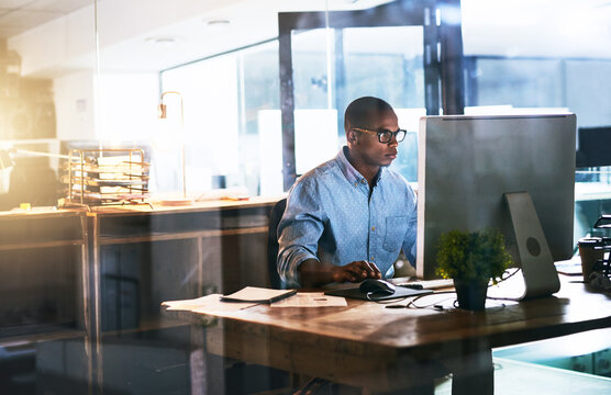 Business man, working and computer with office typing and project web research with connectivity. African male worker, technology and coding for website management or company with tech and internet