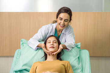 Obraz premium Female doctor or dermatologist examining skin for facial treatment for young patient. Preparing for a cosmetic surgery operation or procedure. Perfect skin, spa and care