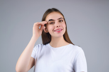 Perfect eyebrows. Natural beauty brows. Eyebrows coloring and lamination. Woman combing eyebrows....