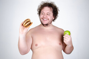 Diet and healthy lifestyle. Funny fat man eating a burger.	