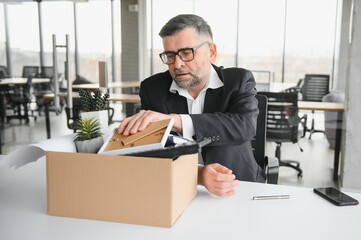 Old businessman employee in relocation concept