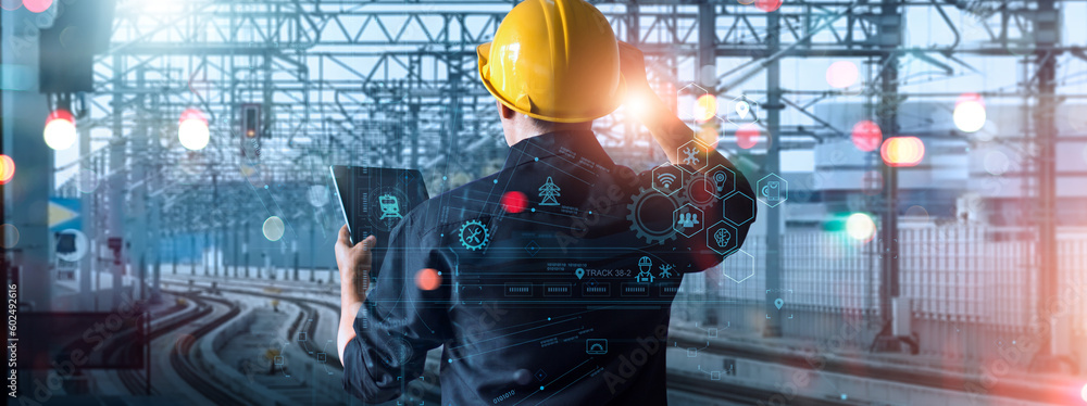 Aufkleber Engineer using tablet checking and analysis data systems electrics of track on railway on networking, Modern Industrial and transportation.