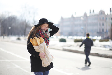 French woman with baguettes in the bag