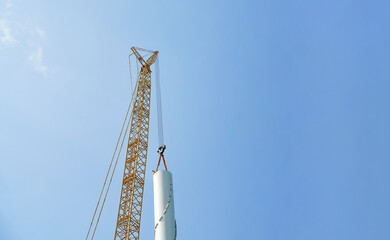 Wind turbines being hoisted and under construction