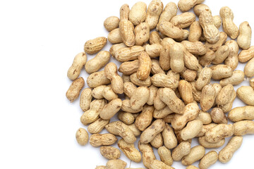 Raw peanuts on white background.