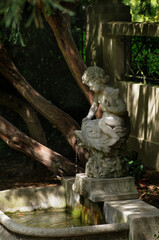 Sculpture of a woman and a child in the garden