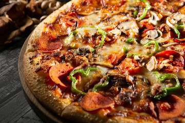 pizza with salami and vegetables