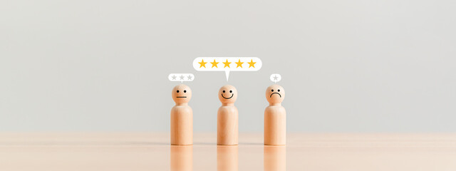 Customer service rating in five stars as an excellent employee in the company on wooden table...
