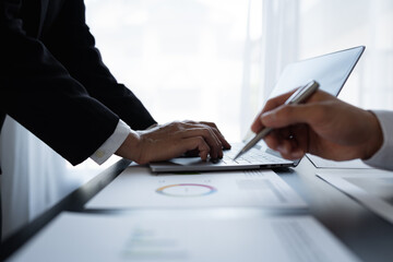 Fototapeta premium accounting marketing analysis Recording and retrieving data from laptop computer. Work management. Brainstorming. Discuss together data from graphs, charts. Teamwork concept.
