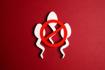 Sperm cells with prohibition forbidden red sign.