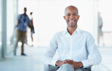 Portrait, business and smile of black man on chair in office with pride for career or job....