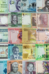 background of different banknotes of African notes that are spread all over the table.
