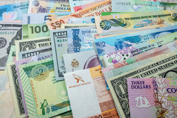 different American world paper money as background