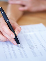 Woman, hands and writing in finance spreadsheet, accounting or paperwork for budget expenses on form. Hand of female accountant working on financial document, checklist or paper with pen for report