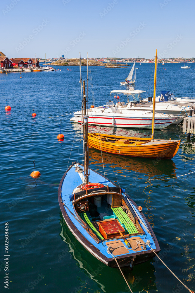 Poster Old wooden boats in a harbor on the coast