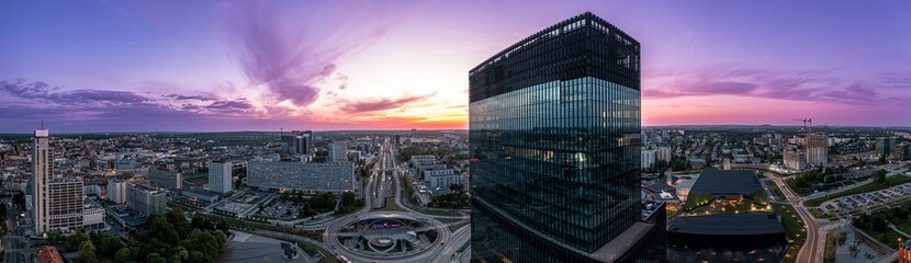 Panoramic aerial drone photo of Katowice city center and office buildings towers with roundabout....