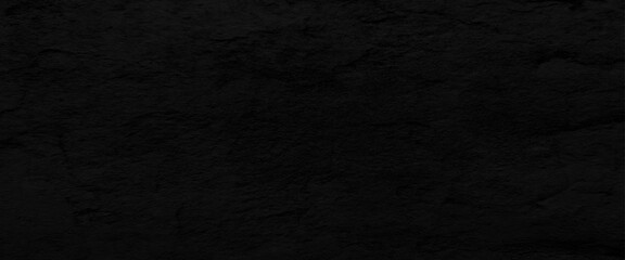 Natural black slate stone background pattern with high resolution. Top view, copy space.