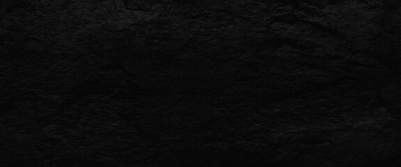 Natural black slate stone background pattern with high resolution. Top view, copy space.