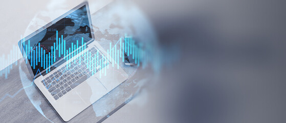 Close up of laptop with glowing upward business chart and globe hologram on blurry wide perspective background with mock up place. Trade, finance and stock market concept. Double exposure.