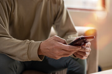 Social media and digital online concept, man using smart phone. The concept of living on vacation and playing social media. Social Distancing ,Working From Home