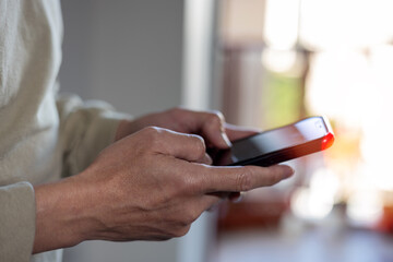 Social media and digital online concept, man using smart phone. The concept of living on vacation and playing social media. Social Distancing ,Working From Home
