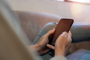 Social media and digital online concept, man using smart phone. The concept of living on vacation and playing social media. Social Distancing ,Working From Home