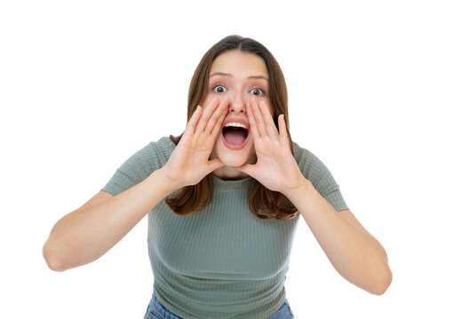 Portrait of young caucasian woman shouting out loud with hands over mouth isolated on white background. Beautiful caucasian girl posing in studio.