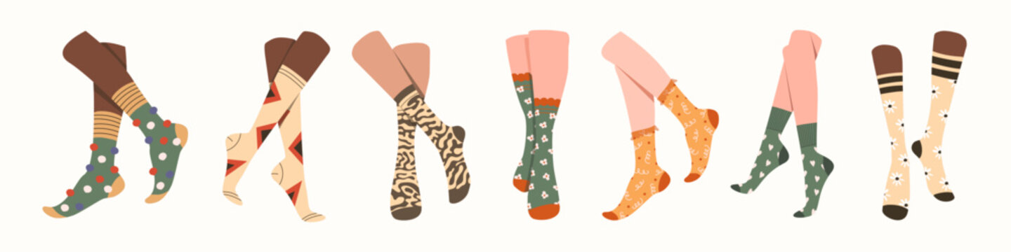 Pairs of feet in socks set. Vector illustrations of female and male underwear. Cartoon warm wool or cotton clothes for legs with funny pattern isolated on white. Accessory, footwear, fashion concept