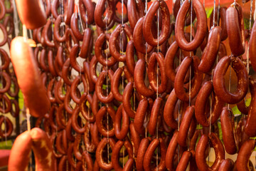 hanging sausages for the drying and smoking process