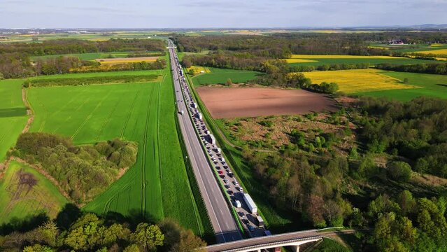 Traffic jam on A4 motorway in Poland due to an accident. Cars and trucks stopped on highway, aerial view