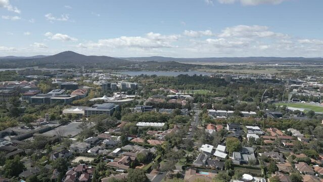 Canberra suburb properties flying drone Shot with Lake Burley Griffin and Mount Pleasant in the background. Canberra, Australia