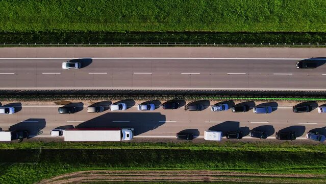 Traffic jam on A4 motorway in Poland due to an accident. Cars and trucks stopped on highway, aerial view