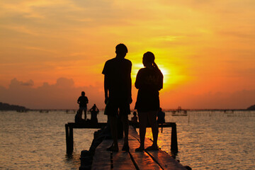 silhouette of a couple on the beach