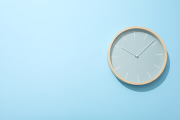 Concept of time change with clock on blue background