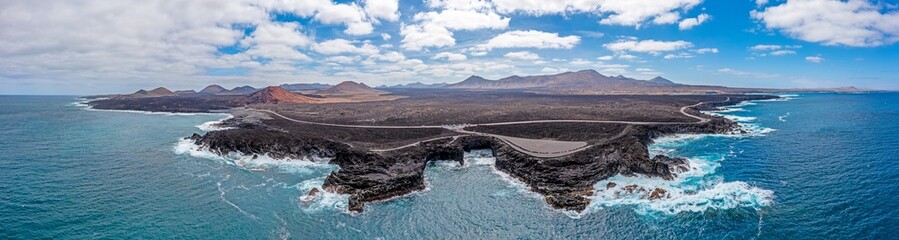 Drone panorama of volcanic coast near El Golfo on Lanzarote with Playa del Paso during daytime - Powered by Adobe