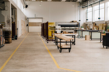 Planks on trolley in modern carpentry factory