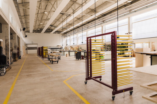 Trolley with racks in modern carpentry factory