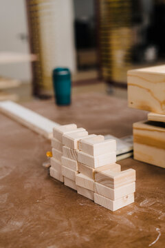 Wood blocks stacked on workbench in carpentry factory