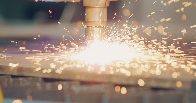 Plasma laser cutting metal sheet with sparks Welding