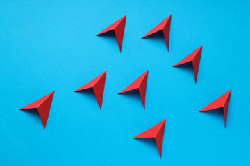 Business, startup and sponsorship concept with arrows on blue background