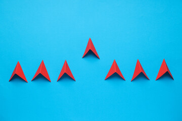 Business, startup and sponsorship concept with arrows on blue background