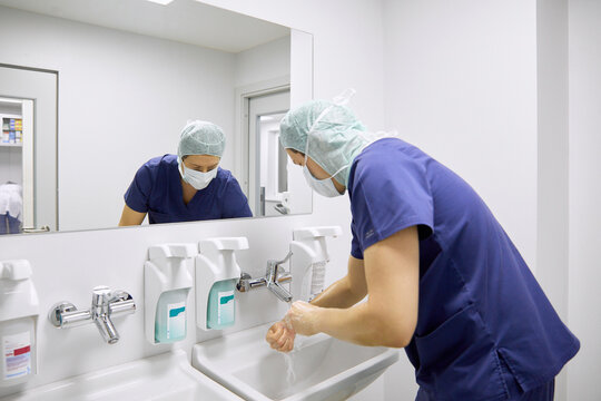 Surgeon washing hands before operation in hospital