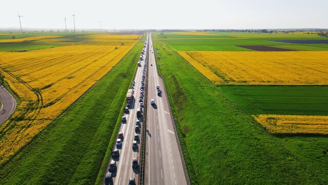 Traffic jam on A4 motorway in Poland due to an accident. Cars and trucks stopped on highway, aerial view