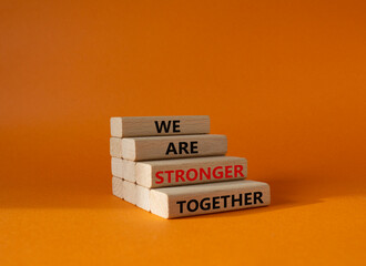 We are stronger together symbol. Wooden blocks with words We are stronger together. Beautiful...