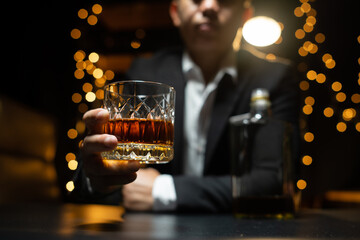 Barman pouring whiskey whiskey glass beautiful night