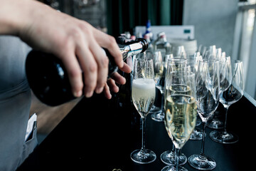 Champagne pouring in glasses.