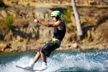 Water sports, wakeboard and surf with man in lake for training, summer break and travel vacation....