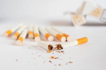 Broken cigarette on white background , World No Tobacco Day Tobacco and lung health concept .