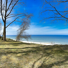Fototapeta na wymiar Beach and sea. View of the coast in beautiful weather. Sunny weather by the sea.